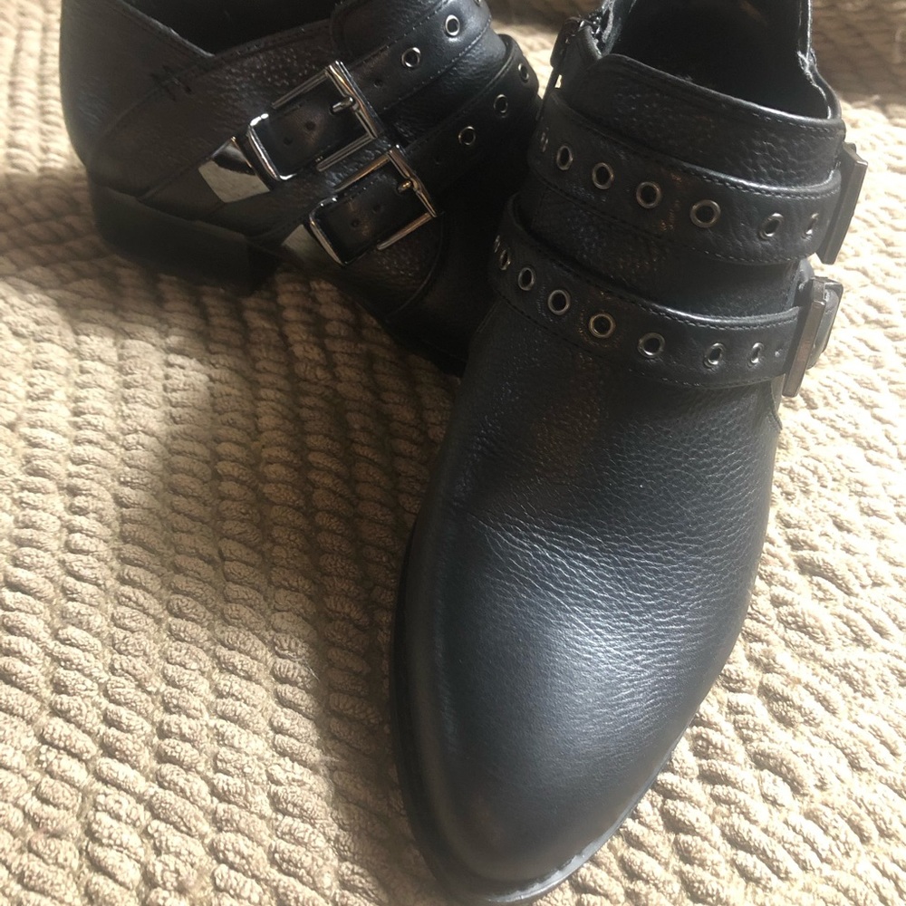 Vince Camuto ankle booties with buckles.